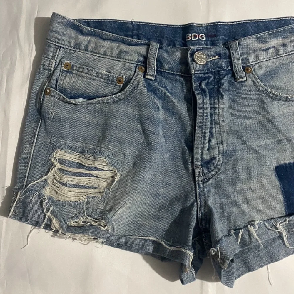 BDG High Rise Button Fly Distressed & Patched Tomgirl Jean Shorts